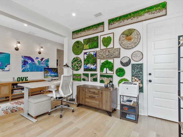 office space with light hardwood / wood-style flooring