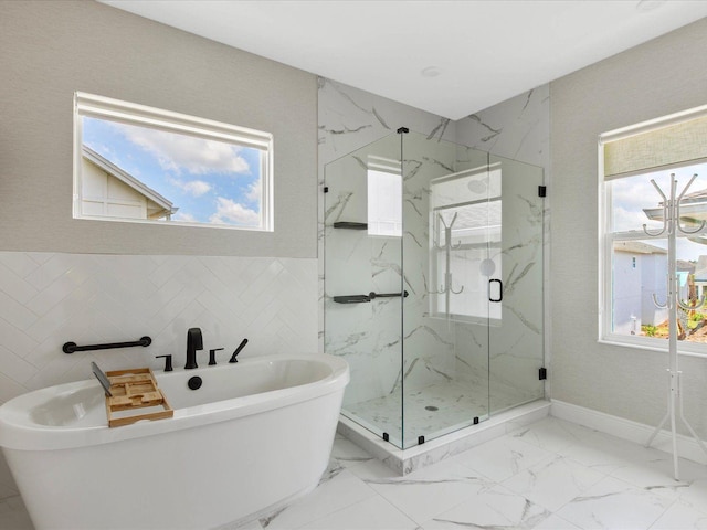 bathroom with separate shower and tub