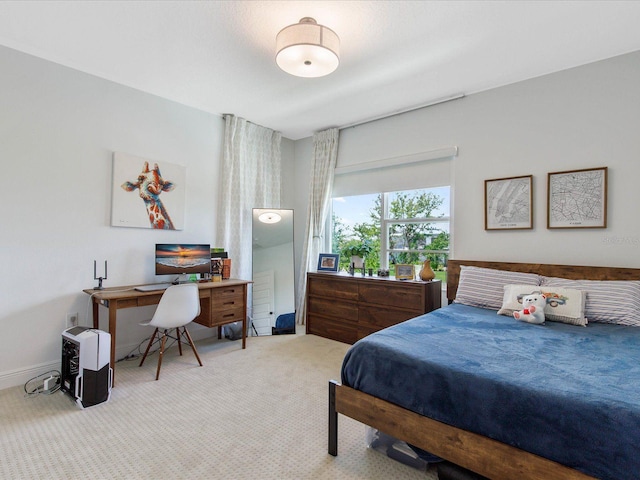 bedroom featuring light colored carpet