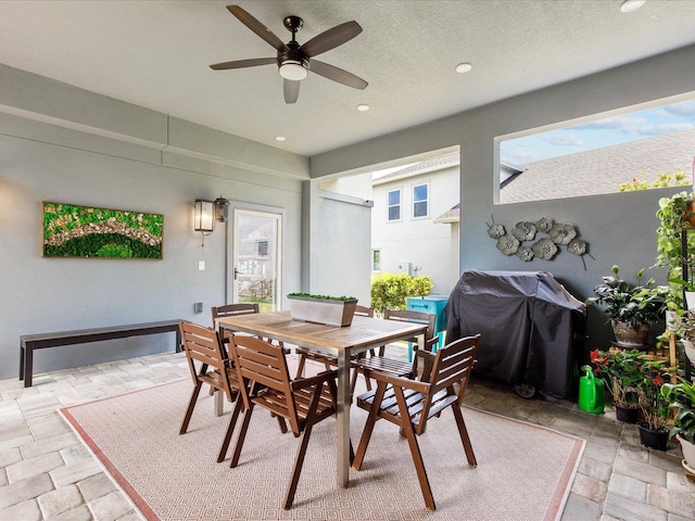 dining area with ceiling fan and a healthy amount of sunlight