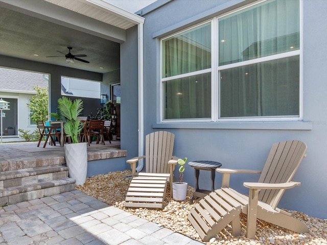 view of patio / terrace featuring ceiling fan