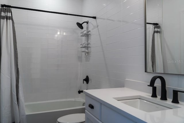 full bathroom with vanity, toilet, and shower / tub combo