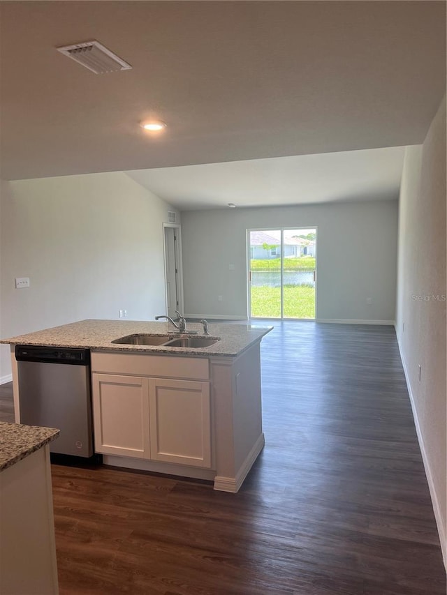 kitchen with white cabinets, sink, stainless steel dishwasher, dark hardwood / wood-style floors, and light stone counters