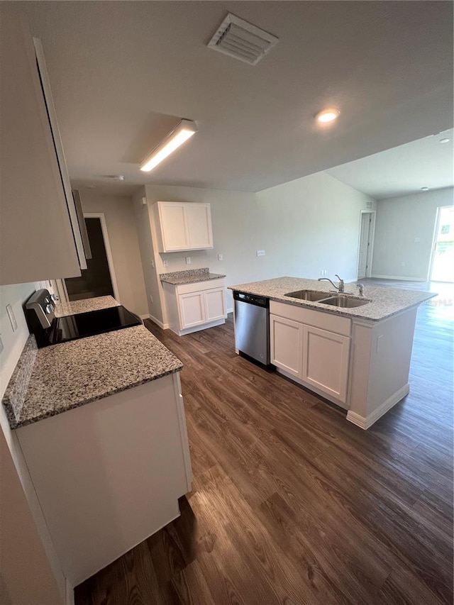 kitchen with white cabinetry, dishwasher, sink, light stone counters, and a kitchen island with sink