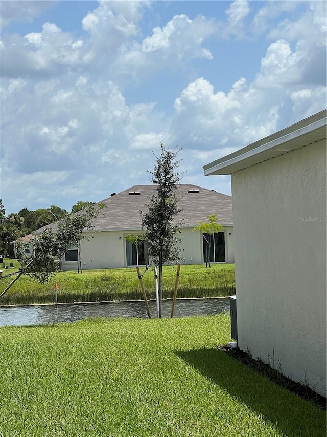 view of yard with a water view