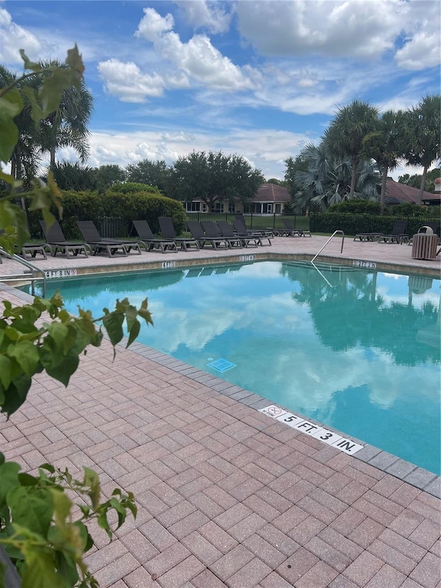 view of swimming pool featuring a patio area