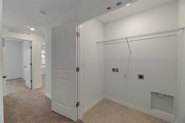 laundry room with hookup for an electric dryer, washer hookup, and light colored carpet