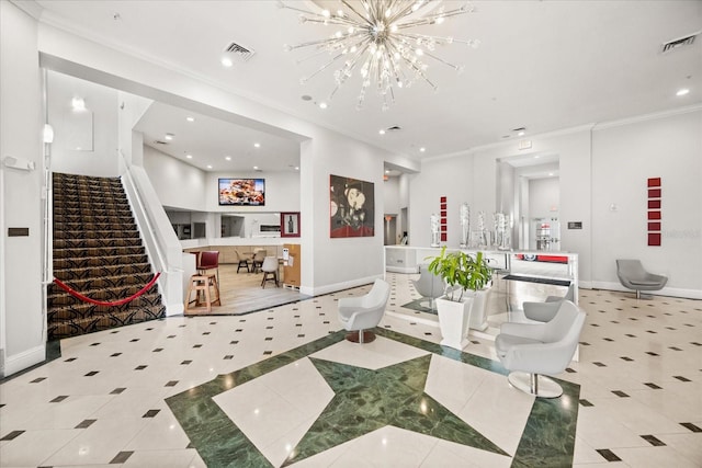 tiled living room featuring ornamental molding and a notable chandelier