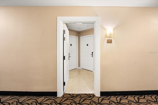 hallway featuring light tile patterned floors