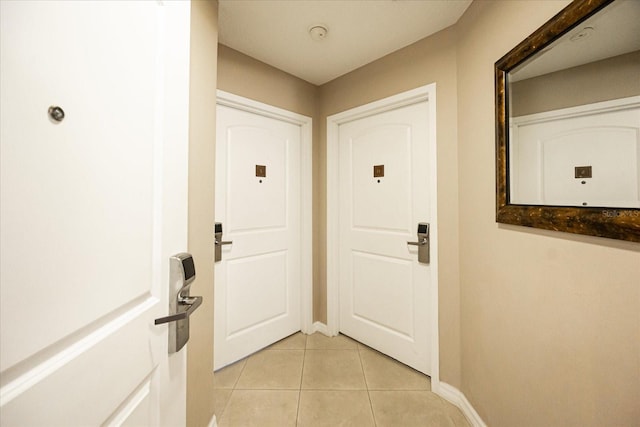 doorway featuring light tile patterned floors