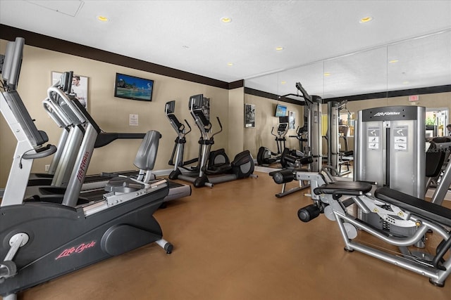 workout area featuring a textured ceiling