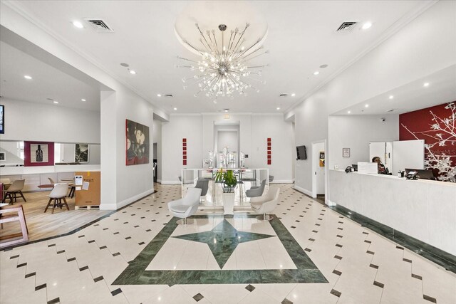 welcome area with a chandelier and visible vents