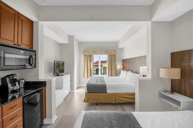 bedroom with baseboards, light wood finished floors, and refrigerator