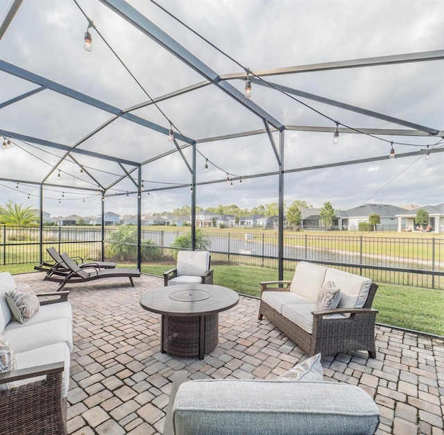 view of patio featuring outdoor lounge area and a lanai