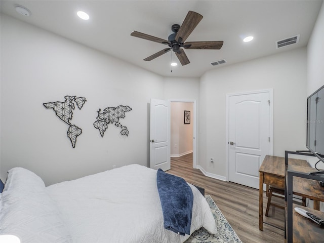 bedroom featuring hardwood / wood-style flooring and ceiling fan