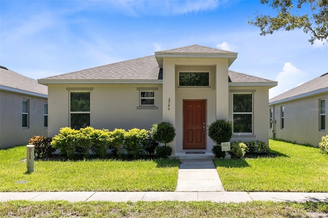 view of front of home with a front lawn