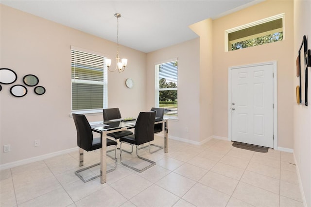 dining room featuring an inviting chandelier and light tile patterned floors