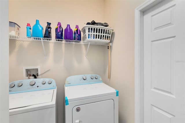 laundry area with independent washer and dryer