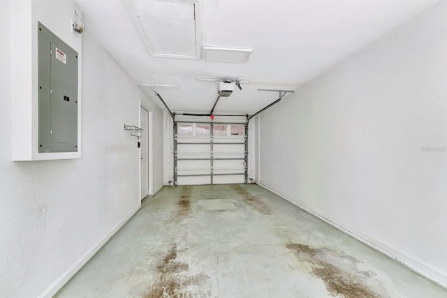 garage with a garage door opener and electric panel