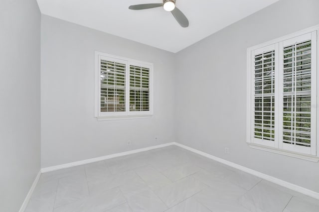 spare room with ceiling fan