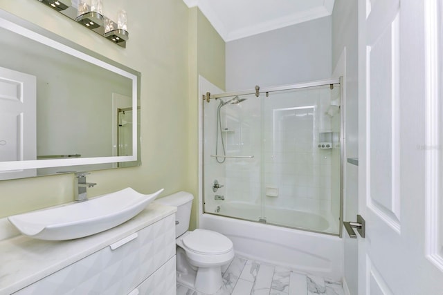 full bathroom featuring ornamental molding, combined bath / shower with glass door, vanity, and toilet