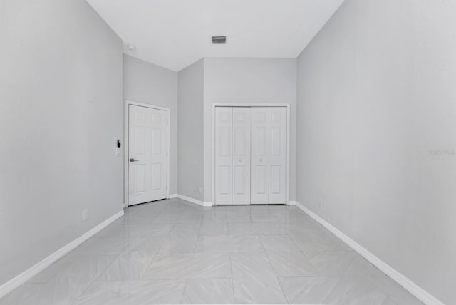 unfurnished bedroom featuring a closet