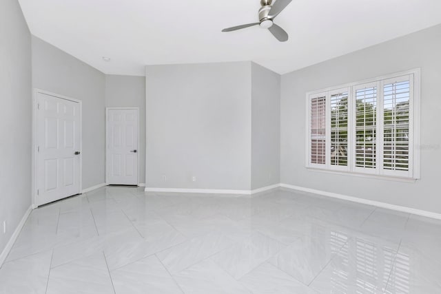 unfurnished room with ceiling fan