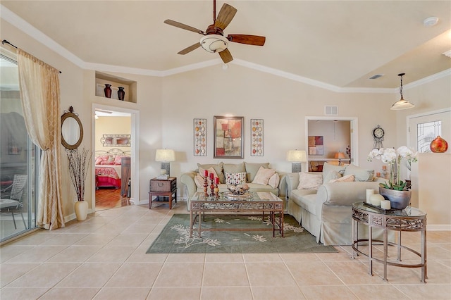 living room featuring ceiling fan, light tile patterned floors, crown molding, and vaulted ceiling