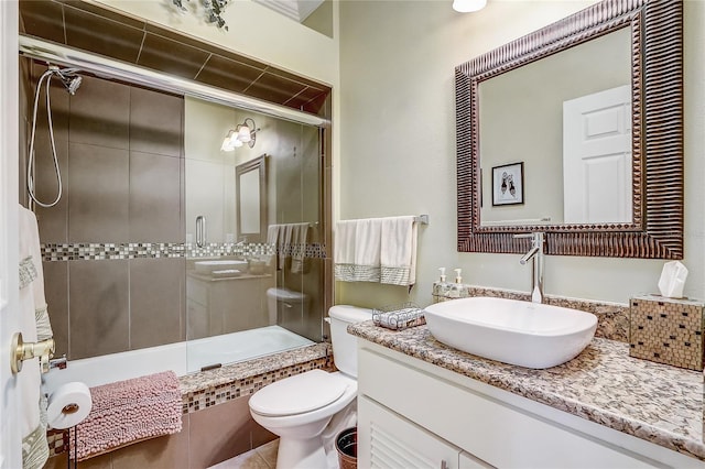 full bathroom featuring shower / bath combination with glass door, vanity, and toilet