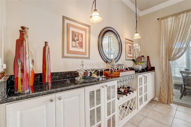 bathroom featuring tile patterned floors and crown molding