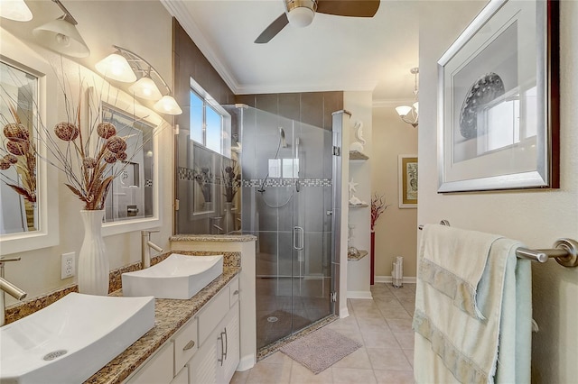 bathroom featuring ceiling fan, walk in shower, tile patterned flooring, crown molding, and vanity