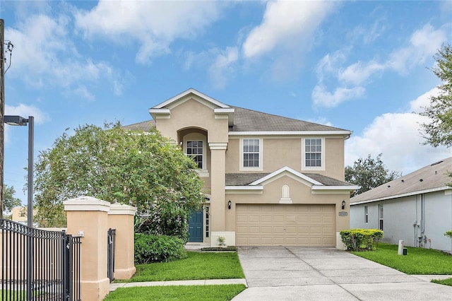 view of front property with a garage and a front yard