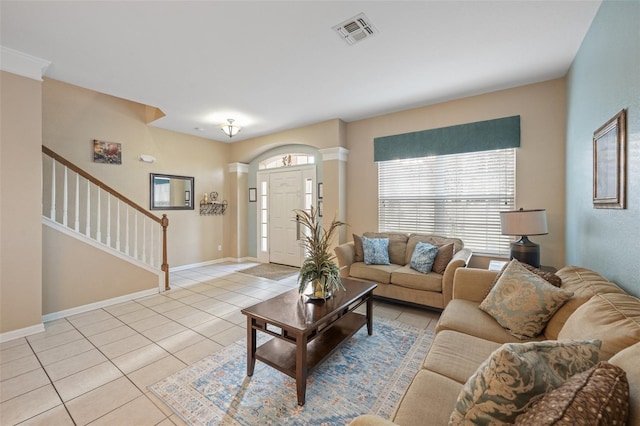 living room with plenty of natural light and light tile patterned flooring