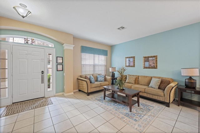 living room with light tile patterned floors and a wealth of natural light