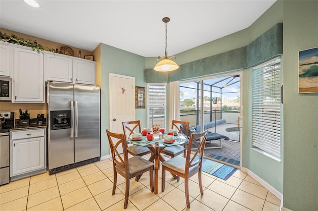 dining space with light tile patterned floors