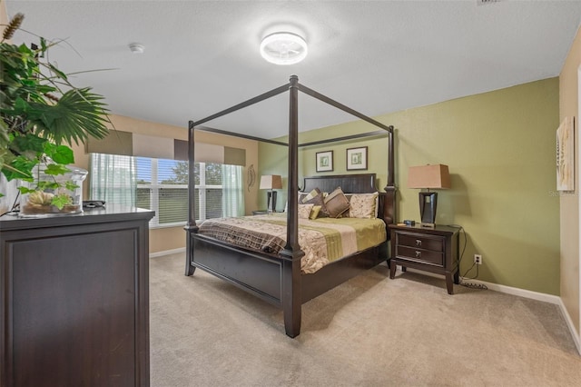 bedroom featuring light carpet