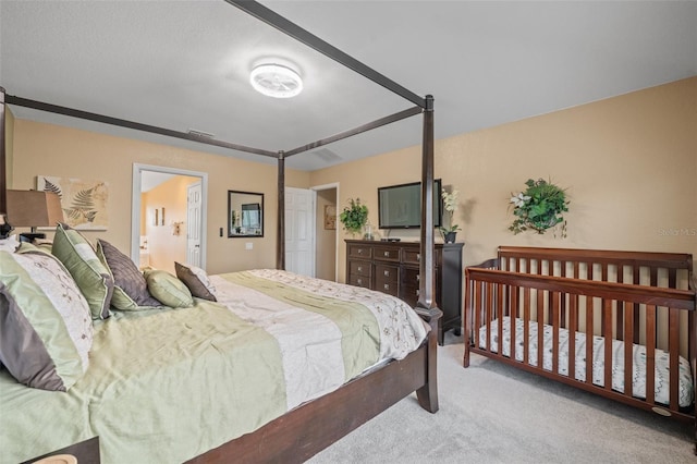 bedroom featuring light colored carpet