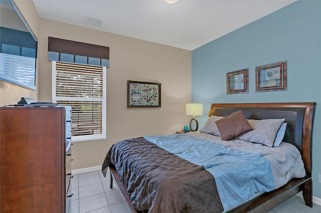 bedroom with light tile patterned floors