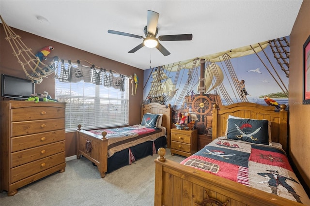 bedroom with ceiling fan and light colored carpet