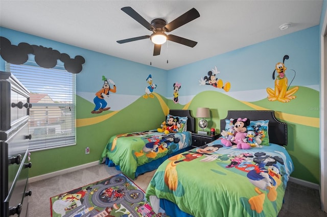 bedroom featuring ceiling fan and carpet