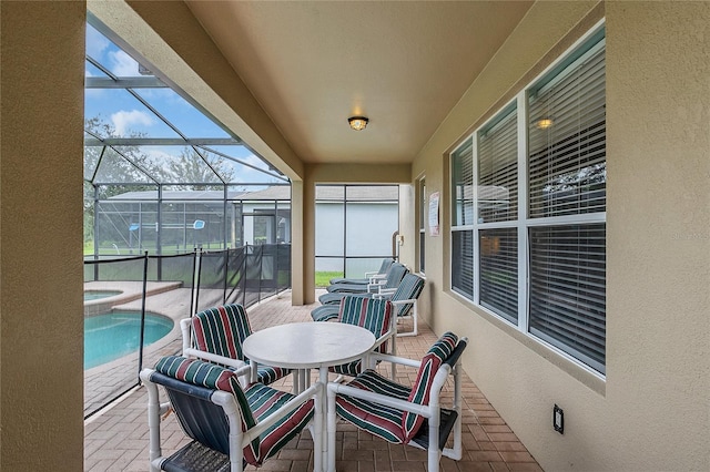 sunroom / solarium with a pool