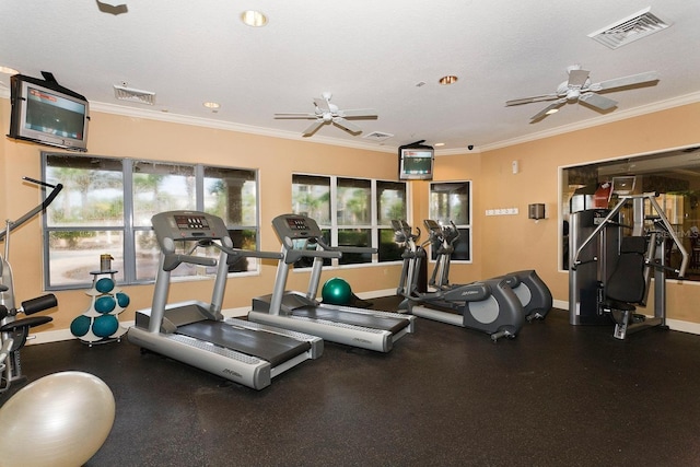 workout area with a textured ceiling, ceiling fan, and crown molding