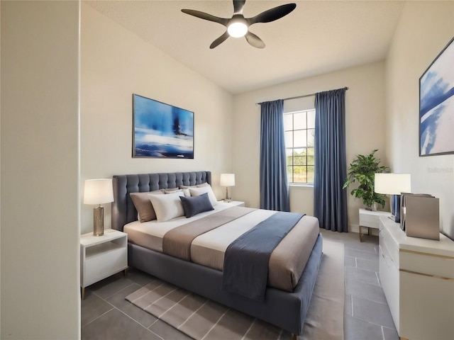 tiled bedroom featuring ceiling fan