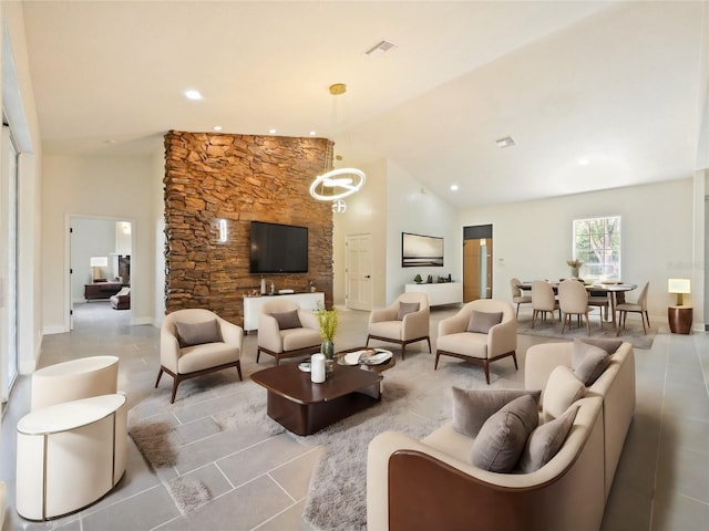 living room with high vaulted ceiling