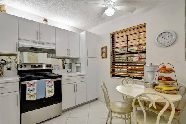 kitchen featuring white cabinetry, ceiling fan, light tile patterned flooring, a textured ceiling, and stainless steel range with electric cooktop