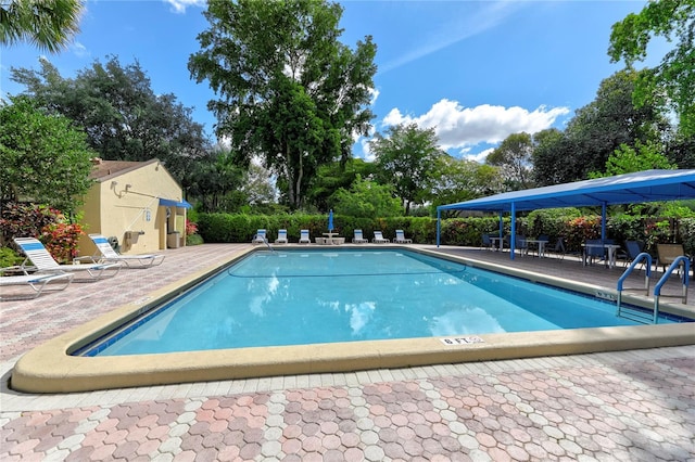 view of swimming pool with a patio