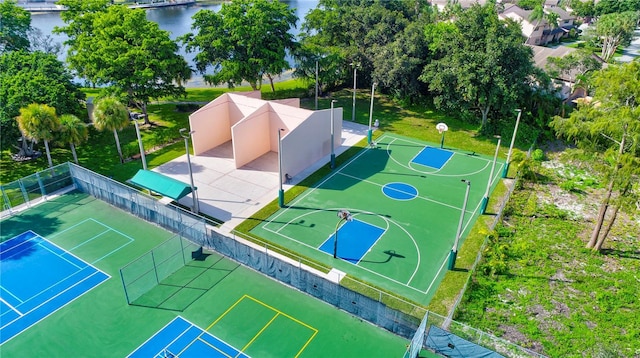 view of basketball court featuring a water view and tennis court