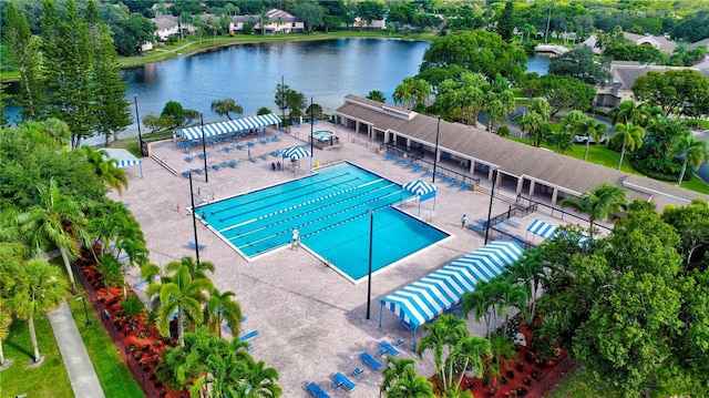 view of swimming pool with a water view