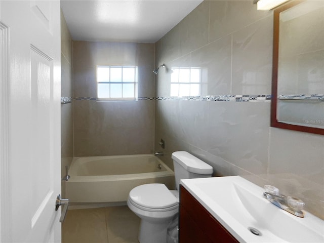 full bathroom featuring shower / bath combination, vanity, tile walls, tile patterned flooring, and toilet