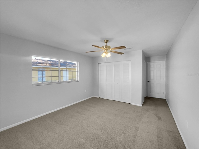 14912 SW 35th Cir, Ocala, FL 34473 - unfurnished bedroom featuring a closet, carpet floors, baseboards, and ceiling fan
